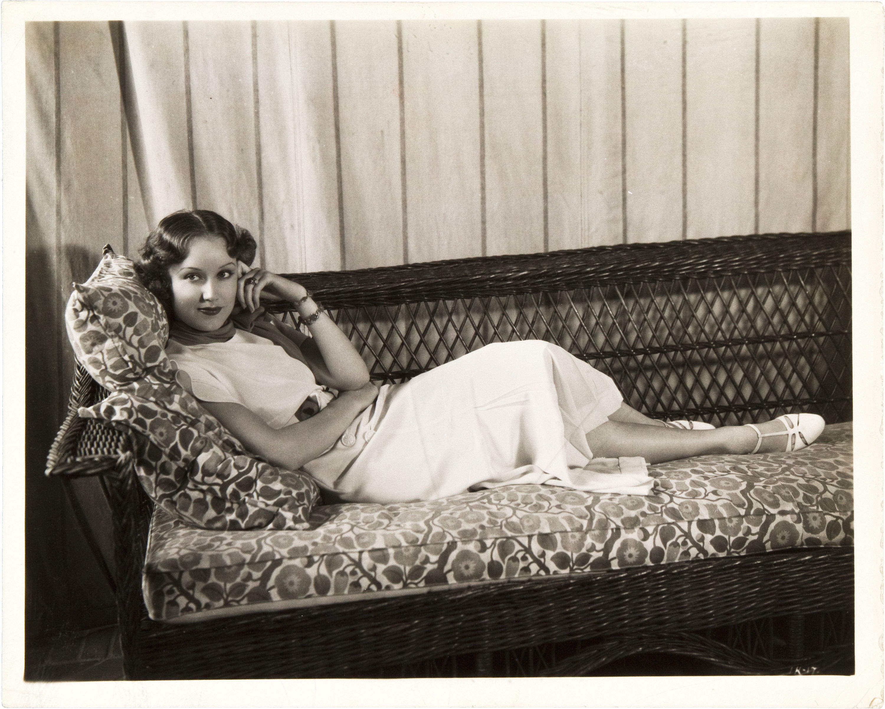 Fay Wray lounging on a sofa